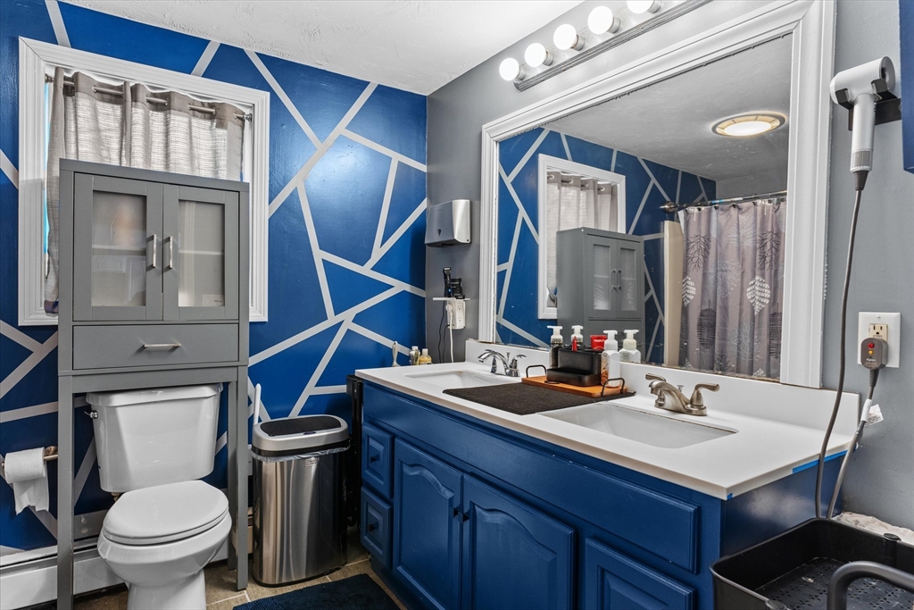 3 Douglas Road Webster, MA 01570 - Photo 8 of 24 a bathroom with a toilet sink and mirror