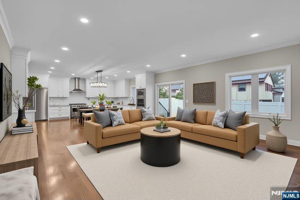 55 Maiden Lane Bergenfield, NJ 07621 - Photo 12 of 49 a living room with furniture and a large window