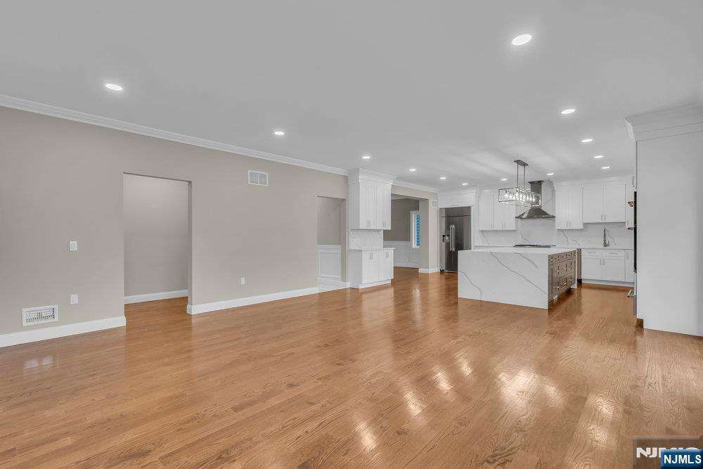 55 Maiden Lane Bergenfield, NJ 07621 - Photo 19 of 49 a view of kitchen with kitchen island a sink and a stove top oven