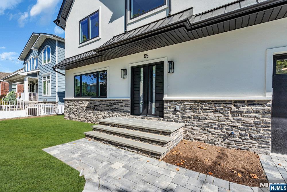 55 Maiden Lane Bergenfield, NJ 07621 - Photo 3 of 49 a view of a house with a yard