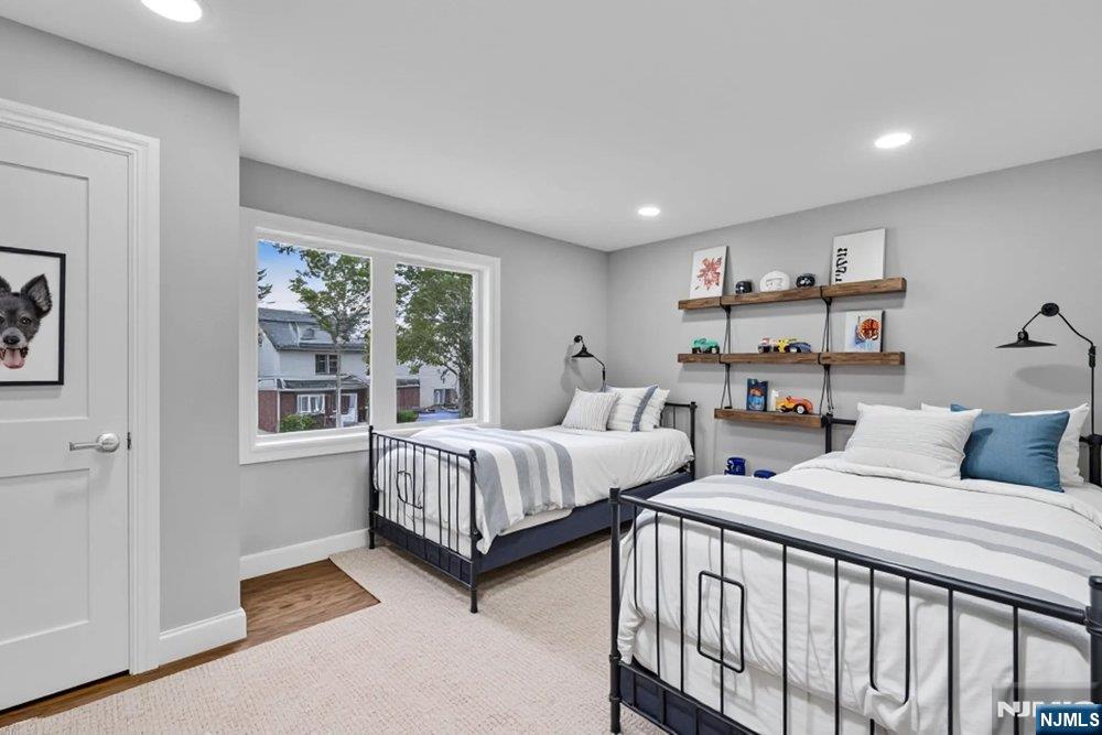 55 Maiden Lane Bergenfield, NJ 07621 - Photo 33 of 49 a bedroom with two beds and a large window