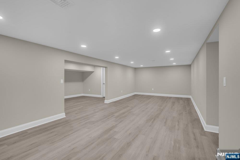 55 Maiden Lane Bergenfield, NJ 07621 - Photo 43 of 49 a view of an empty room with wooden floor and closet