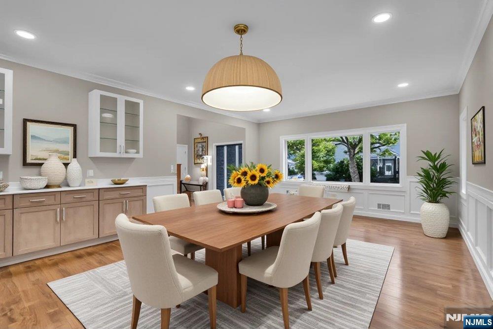 55 Maiden Lane Bergenfield, NJ 07621 - Photo 8 of 49 a view of a dining room with furniture window and wooden floor