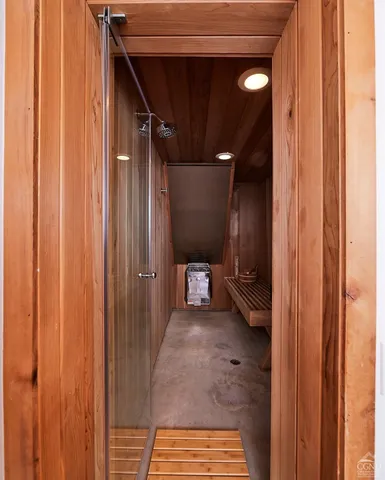a living room with furniture wooden floor and a large window