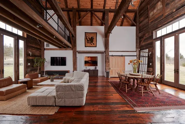 a view of a dining room with furniture and window