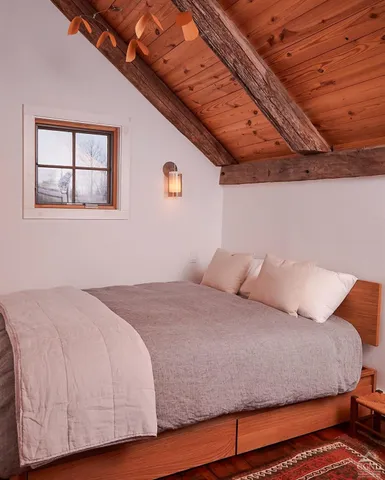 a view of hallway with wooden floor