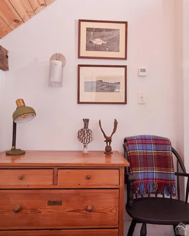 a view of a bedroom with furniture