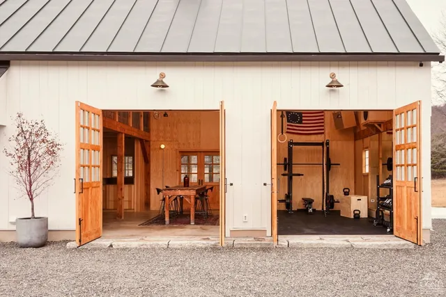 a kitchen with cabinets and wooden floor
