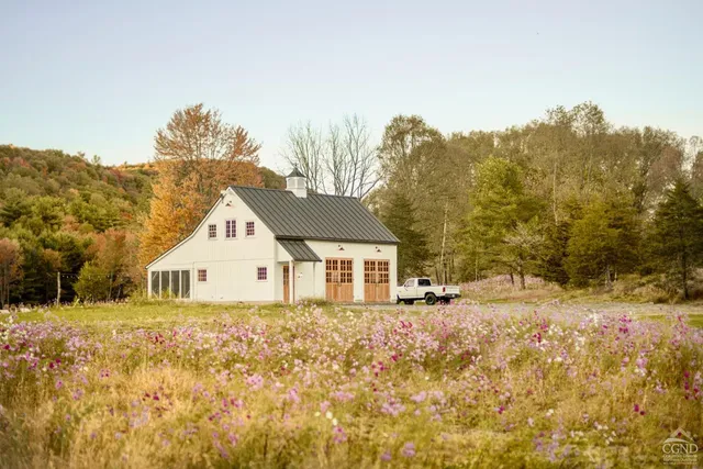 a view of a house with a snow on the background