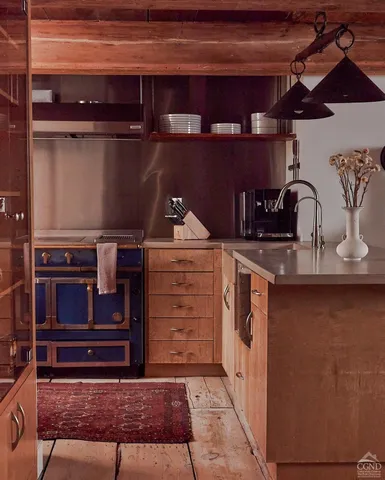 a bedroom with furniture and wooden floor