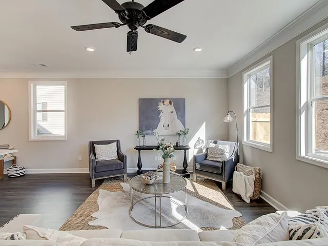 a living room with furniture and a window