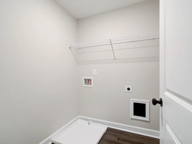 a large kitchen with kitchen island a large counter space a sink stainless steel appliances and cabinets