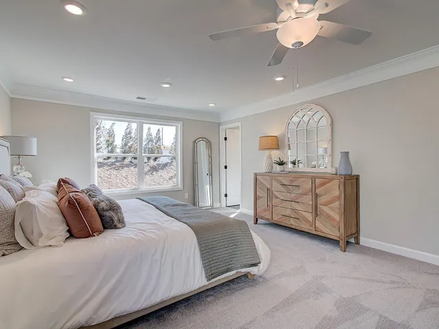 a bed room with a bed and a window