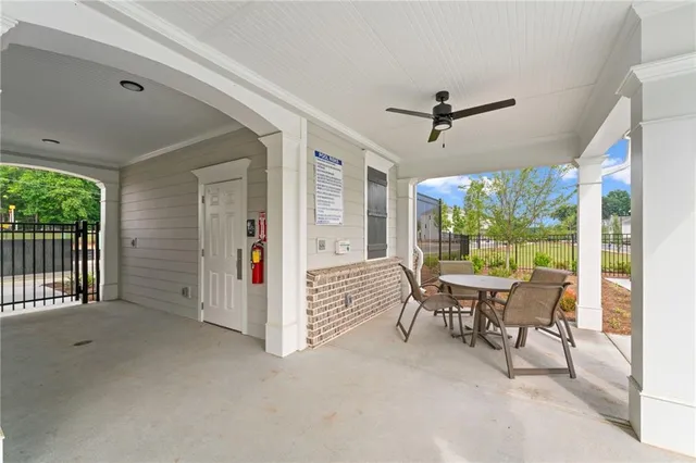 a view of a swimming pool with lounge chairs