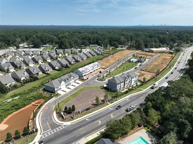 an aerial view of a house with a big yard