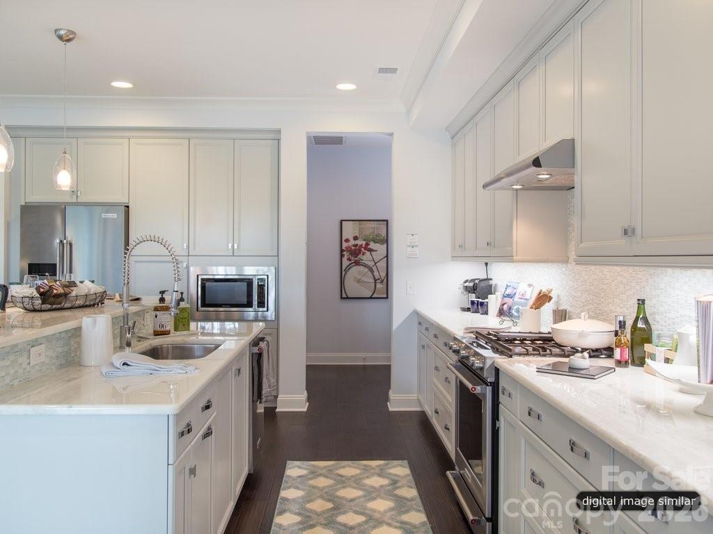 2008 Thatcher Way Fort Mill, SC 29715 - Photo 11 of 27 a kitchen with a sink stove and cabinets