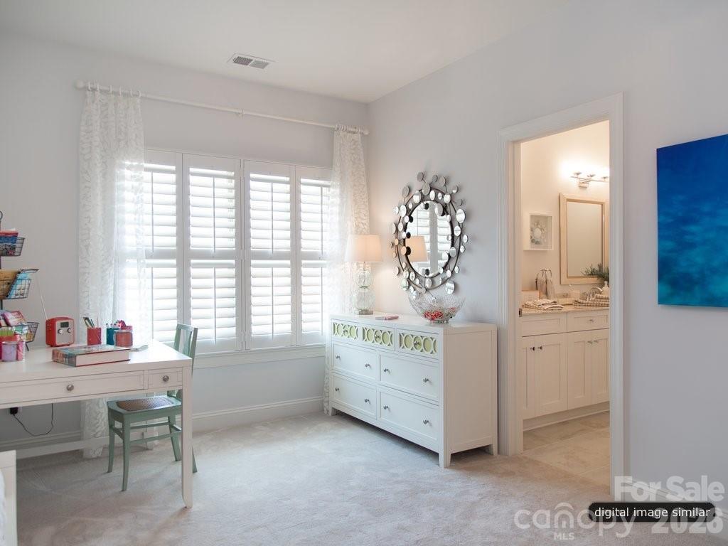 2008 Thatcher Way Fort Mill, SC 29715 - Photo 21 of 27 a spacious bedroom with a bed and a table in it