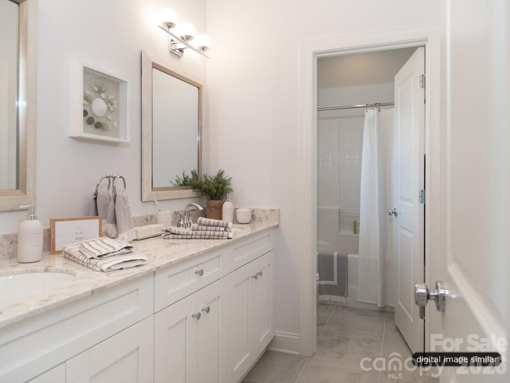 2008 Thatcher Way Fort Mill, SC 29715 - Photo 22 of 27 a bathroom with a sink and a mirror