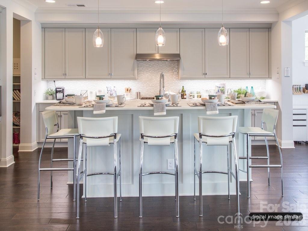 2008 Thatcher Way Fort Mill, SC 29715 - Photo 8 of 27 a kitchen with kitchen island granite countertop a table and chairs in it