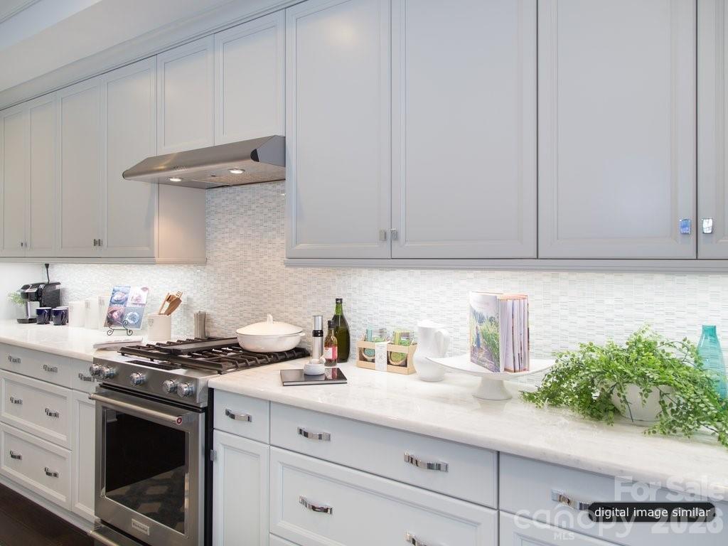 2008 Thatcher Way Fort Mill, SC 29715 - Photo 10 of 27 a kitchen with stainless steel appliances granite countertop white cabinets and a stove
