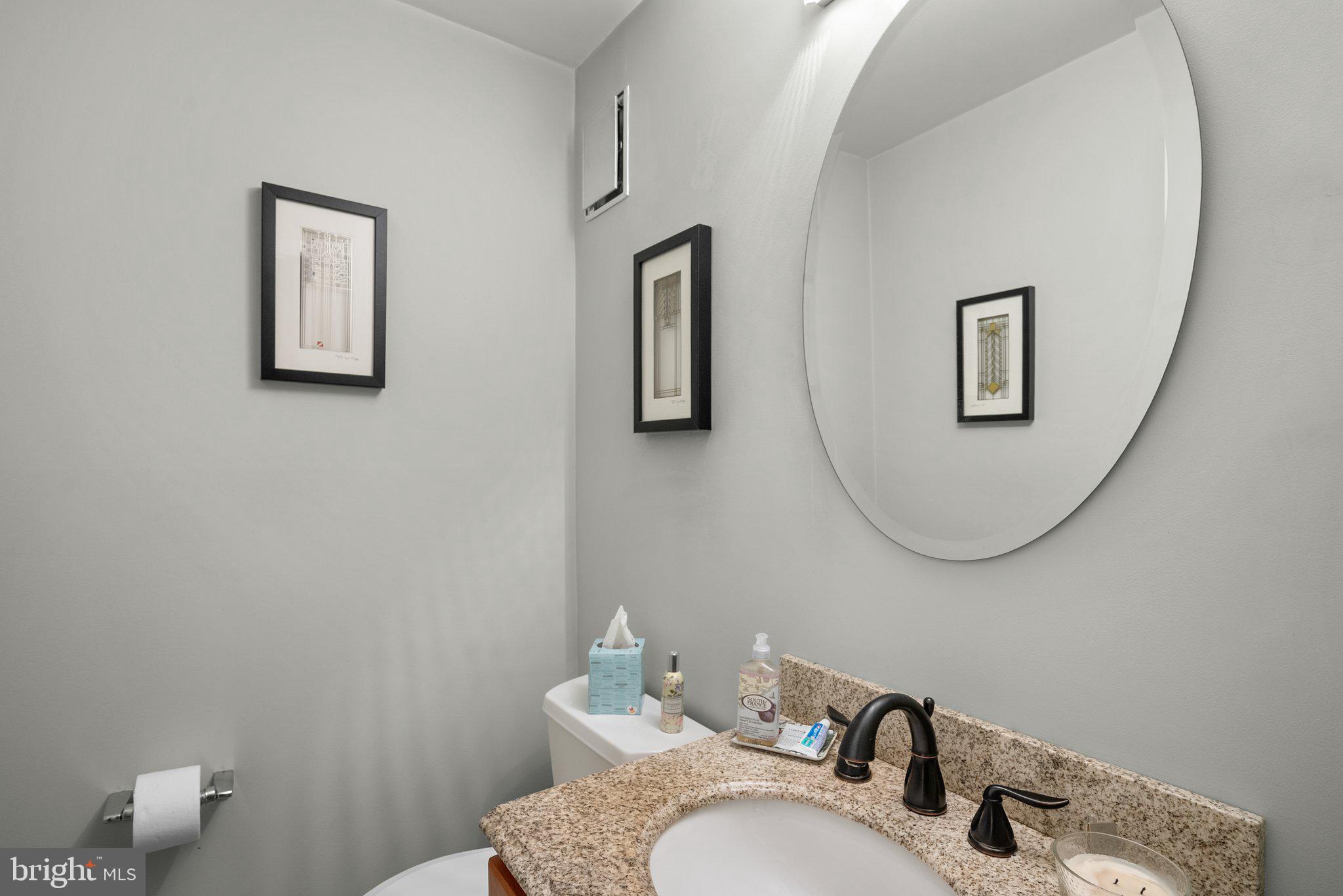 1007 La Grande Road Silver Spring, MD 20903 - Photo 12 of 48 a bathroom with a granite countertop toilet and a sink
