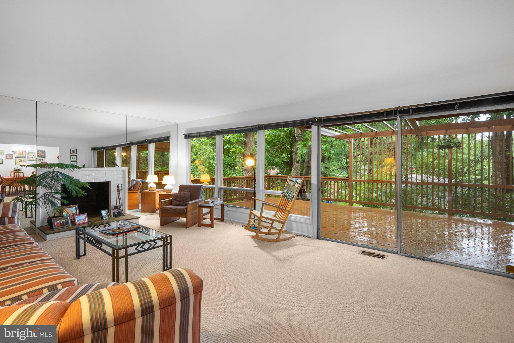 1007 La Grande Road Silver Spring, MD 20903 - Photo 13 of 48 a living room with furniture a floor to ceiling window and floor to ceiling window