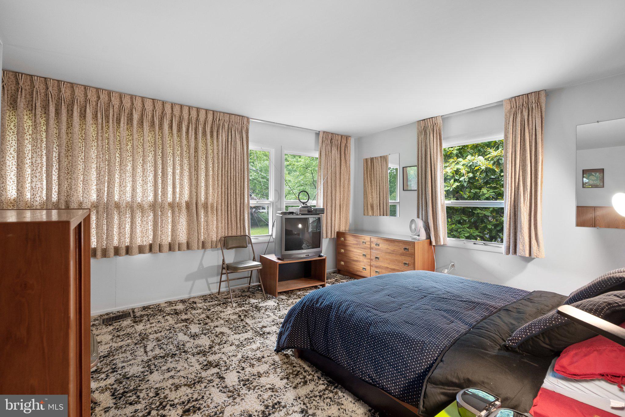 1007 La Grande Road Silver Spring, MD 20903 - Photo 18 of 48 a bedroom with a bed and wooden floor