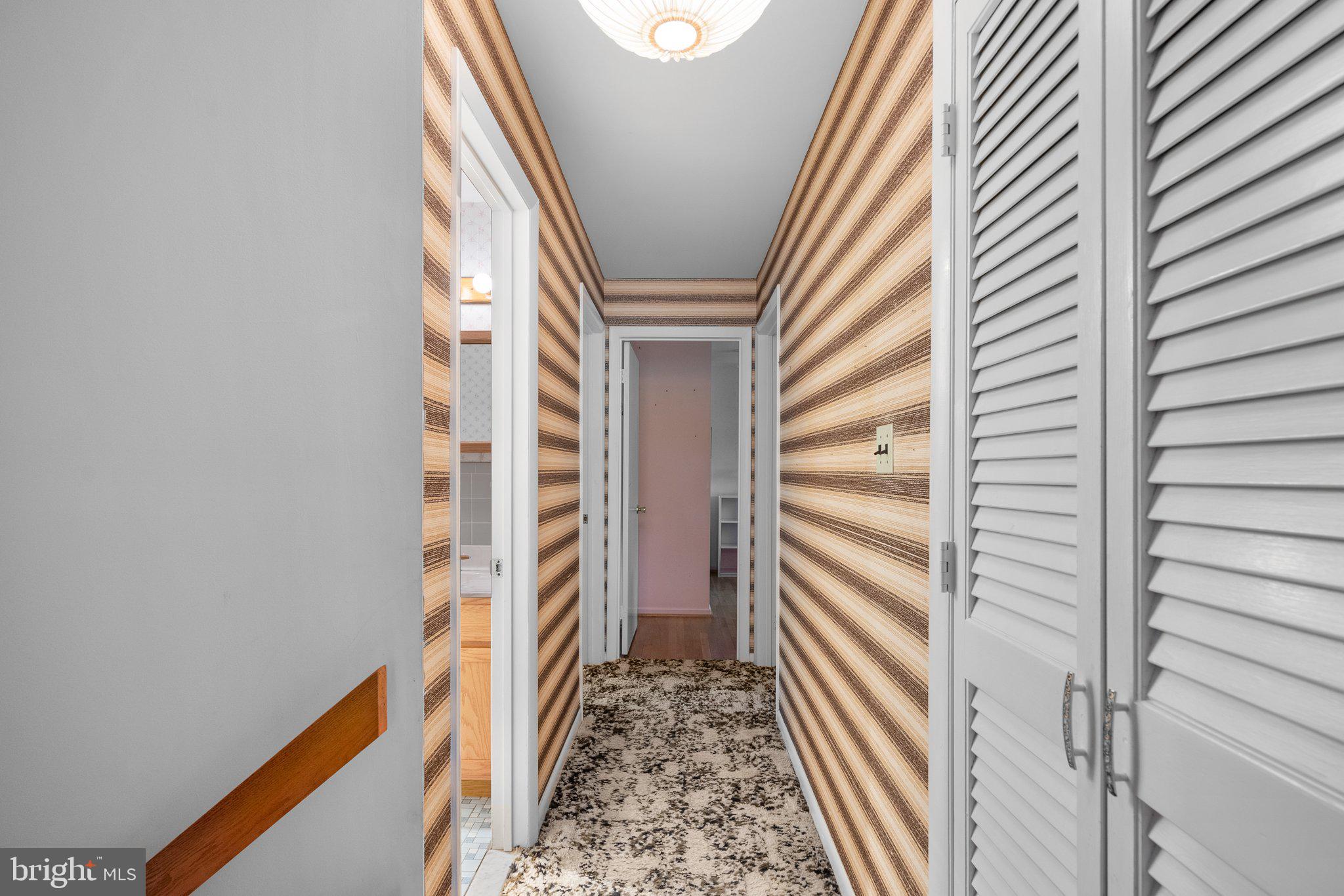1007 La Grande Road Silver Spring, MD 20903 - Photo 24 of 48 a view of a hallway with wooden floor and staircase