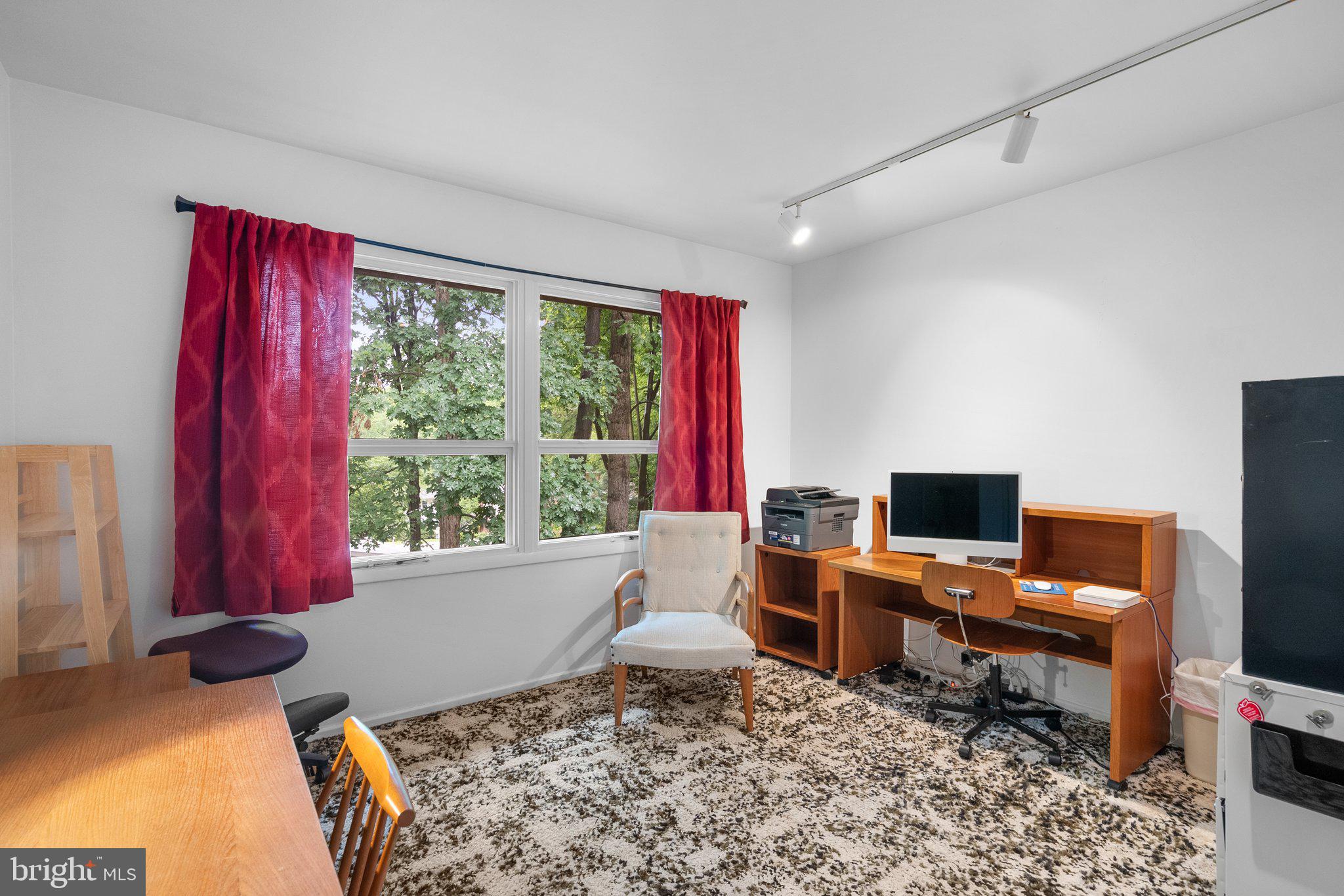 1007 La Grande Road Silver Spring, MD 20903 - Photo 28 of 48 a living room with furniture a rug and a flat screen tv