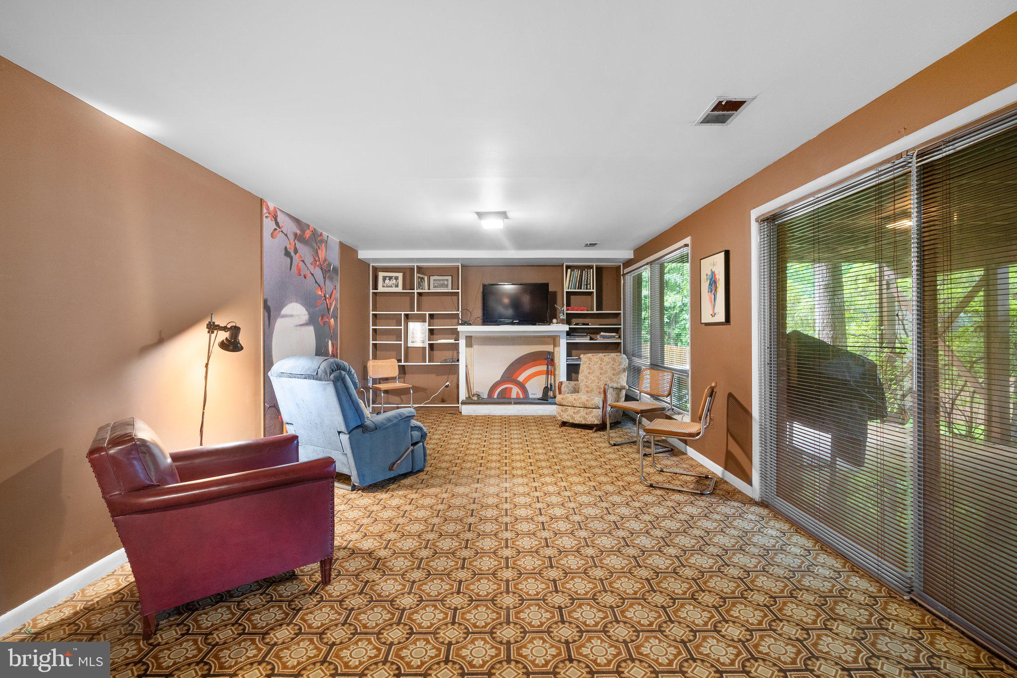1007 La Grande Road Silver Spring, MD 20903 - Photo 33 of 48 a living room with furniture and a floor to ceiling window