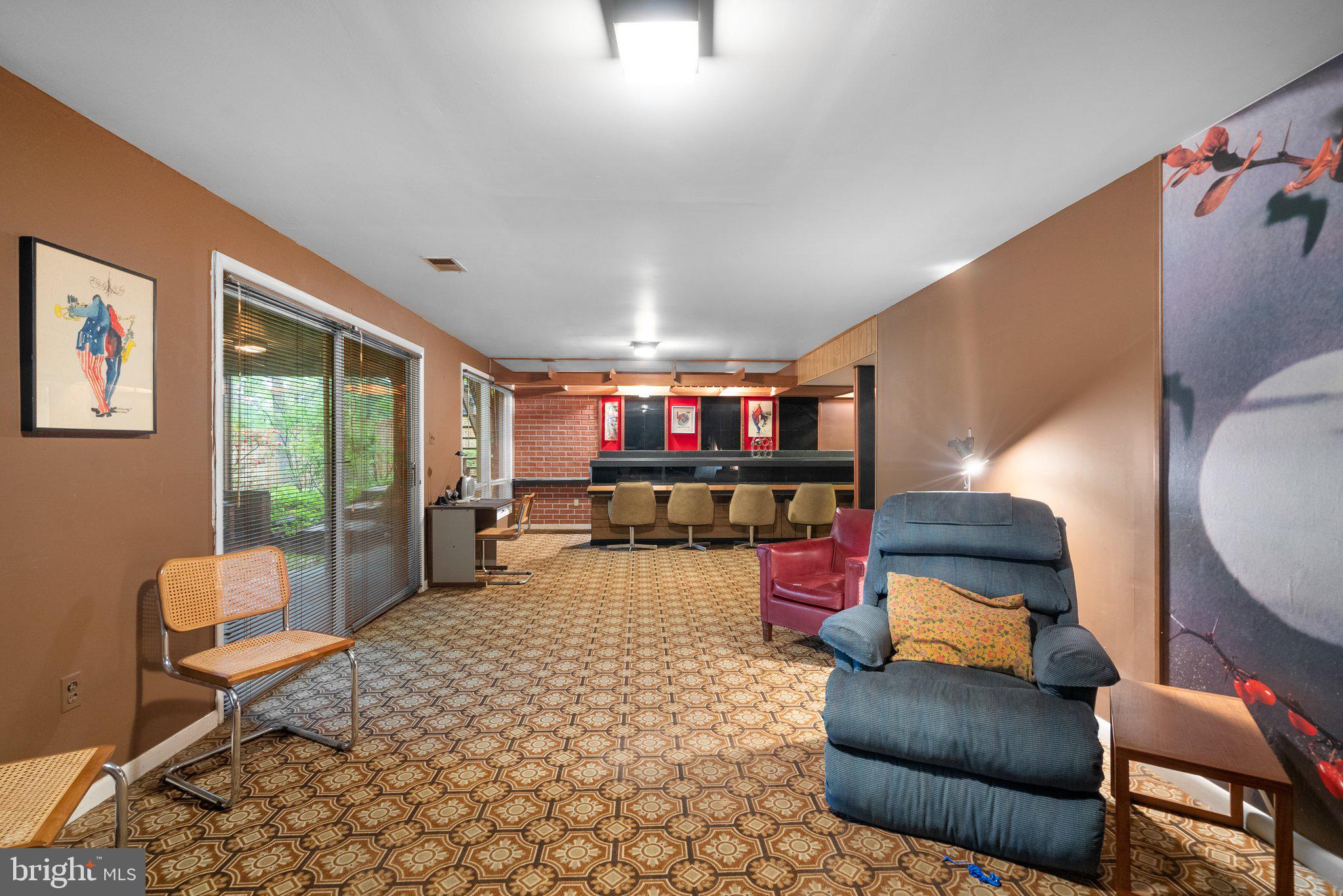 1007 La Grande Road Silver Spring, MD 20903 - Photo 35 of 48 a living room with furniture and a flat screen tv