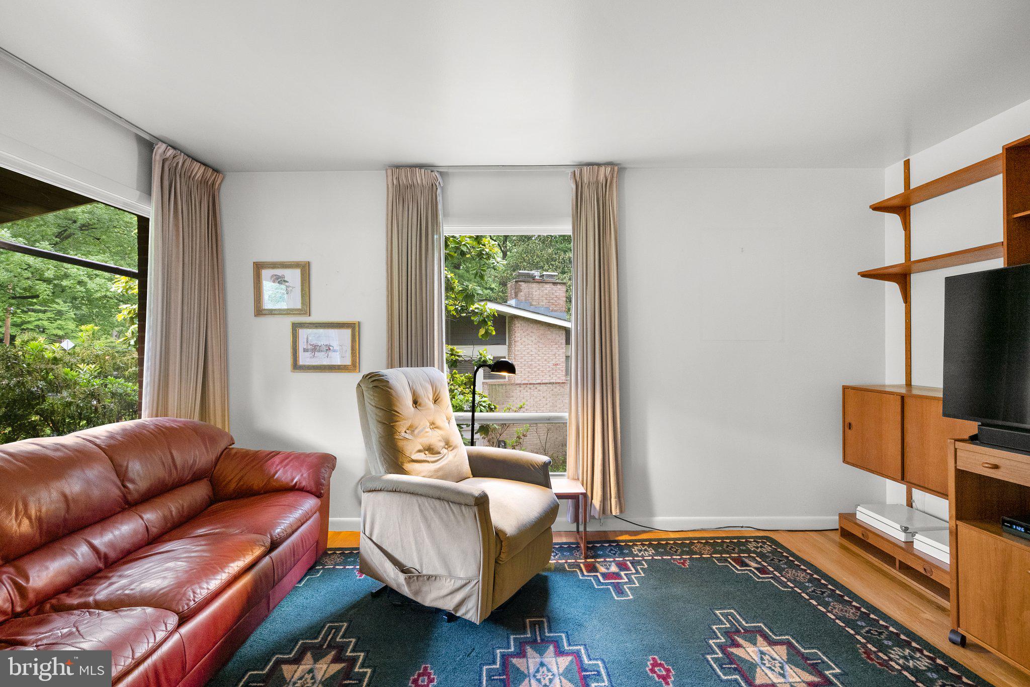 1007 La Grande Road Silver Spring, MD 20903 - Photo 5 of 48 a living room with furniture a window and a flat screen tv