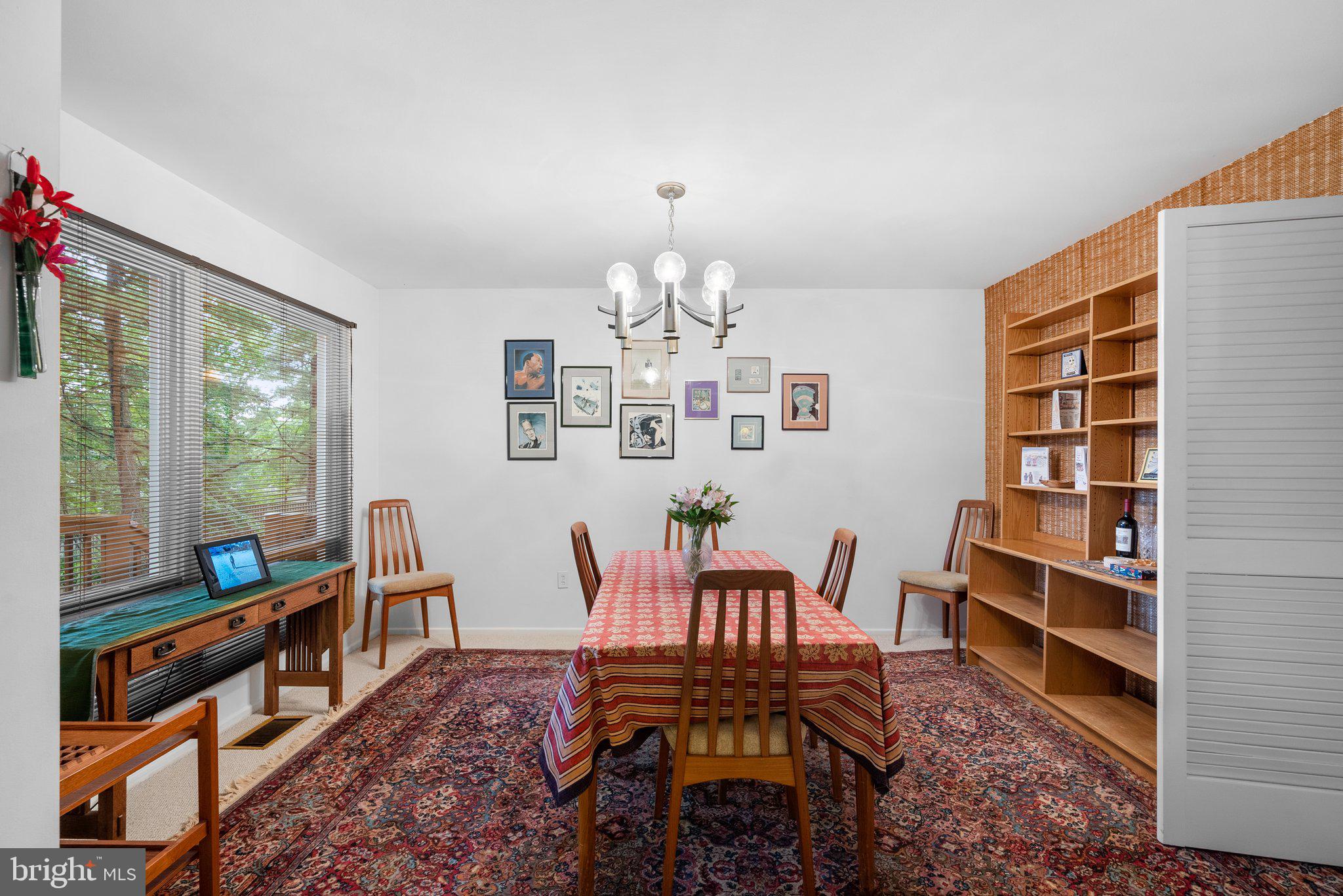 1007 La Grande Road Silver Spring, MD 20903 - Photo 10 of 48 a dining room with furniture a rug and a chandelier