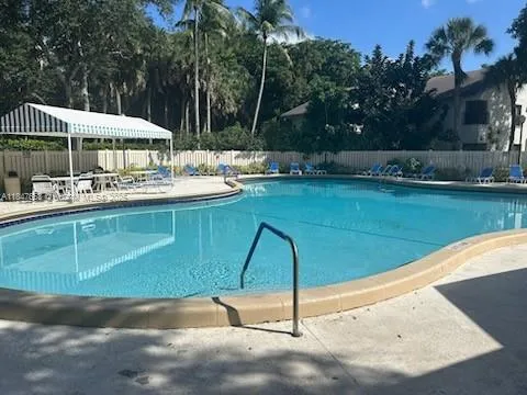 a view of a swimming pool with a patio