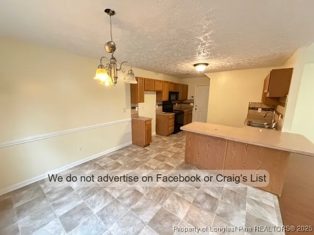 a spacious bathroom with a tub sink and a mirror