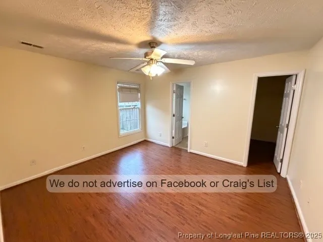 a view of a room with window and wooden floor