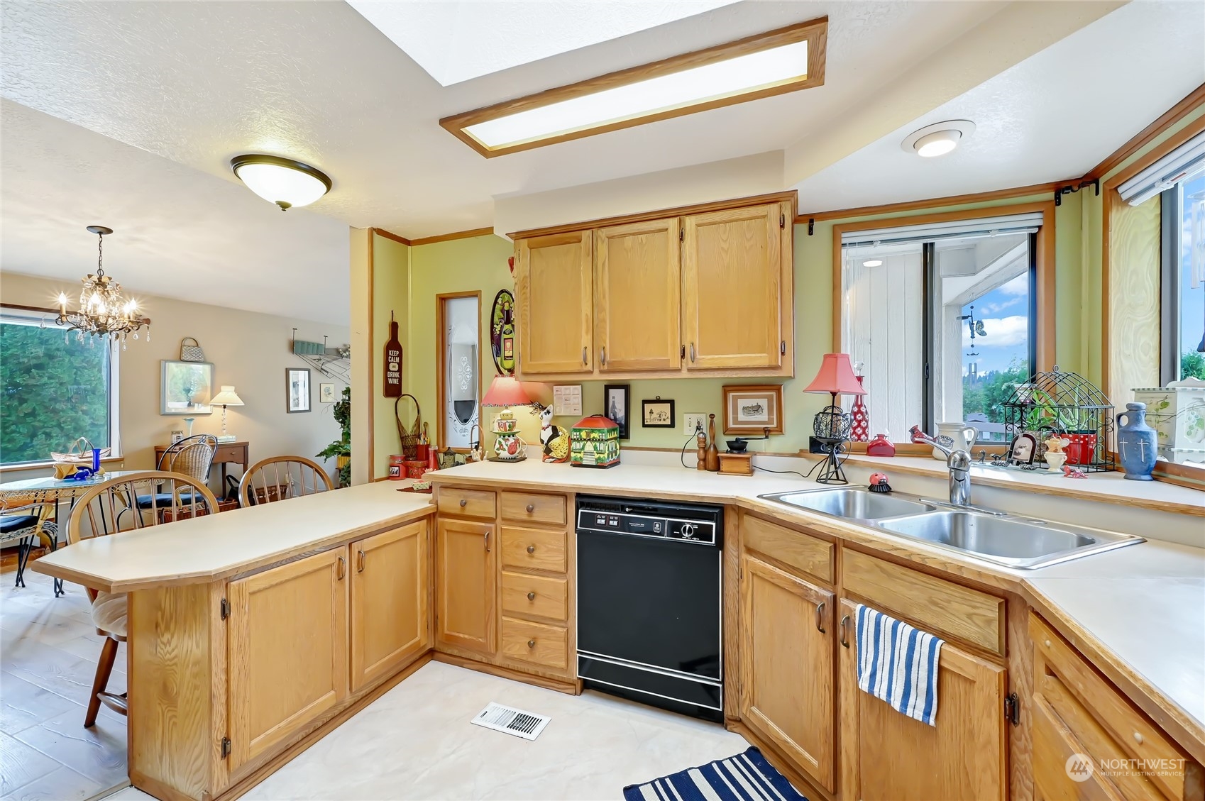 805 236th Place Southwest Bothell, WA 98021 - Photo 12 of 31 a kitchen with a sink stove and cabinets