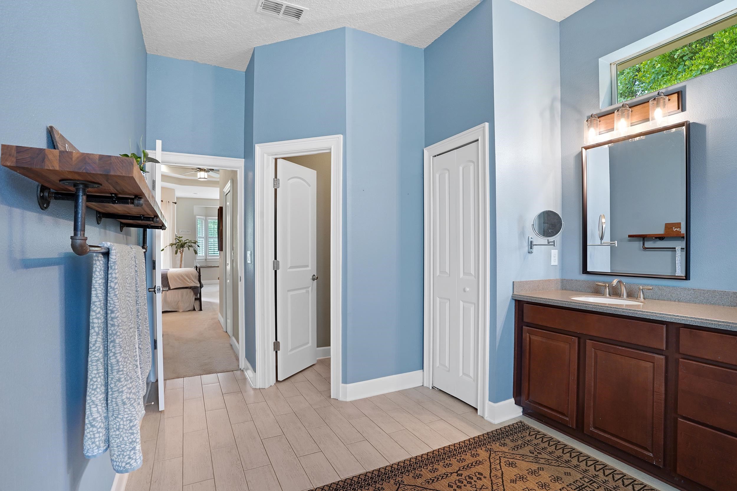 1308 Acorn Ridge Court St. Augustine, FL 32092 - Photo 24 of 47 a view of a kitchen from the hallway with a sink and a fireplace