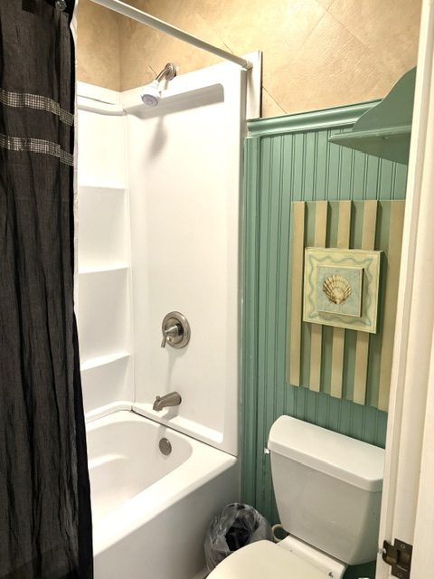 3880 Wyllie Road, Unit 8C Princeville, HI 96722 - Photo 14 of 18 a bathroom with a sink a toilet and shower