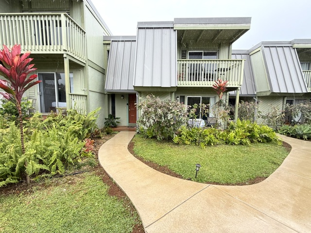 3880 Wyllie Road, Unit 8C Princeville, HI 96722 - Photo 5 of 18 a view of a house with a swimming pool and sitting area
