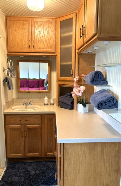 3880 Wyllie Road, Unit 8C Princeville, HI 96722 - Photo 9 of 18 a kitchen with stainless steel appliances granite countertop a sink and a cabinets