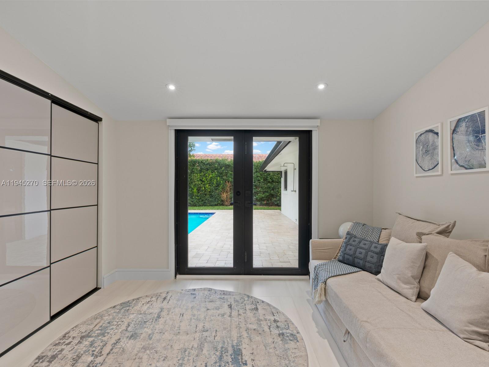 511 Southeast 14th Street Pompano Beach, FL 33060 - Photo 20 of 23 a large bedroom with a bed and a window