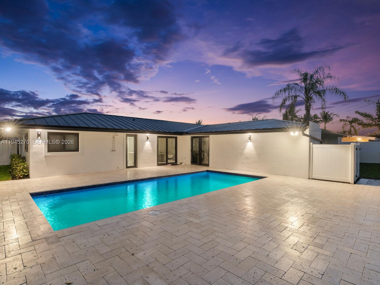 511 Southeast 14th Street Pompano Beach, FL 33060 - Photo 22 of 23 a view of a swimming pool with an open kitchen