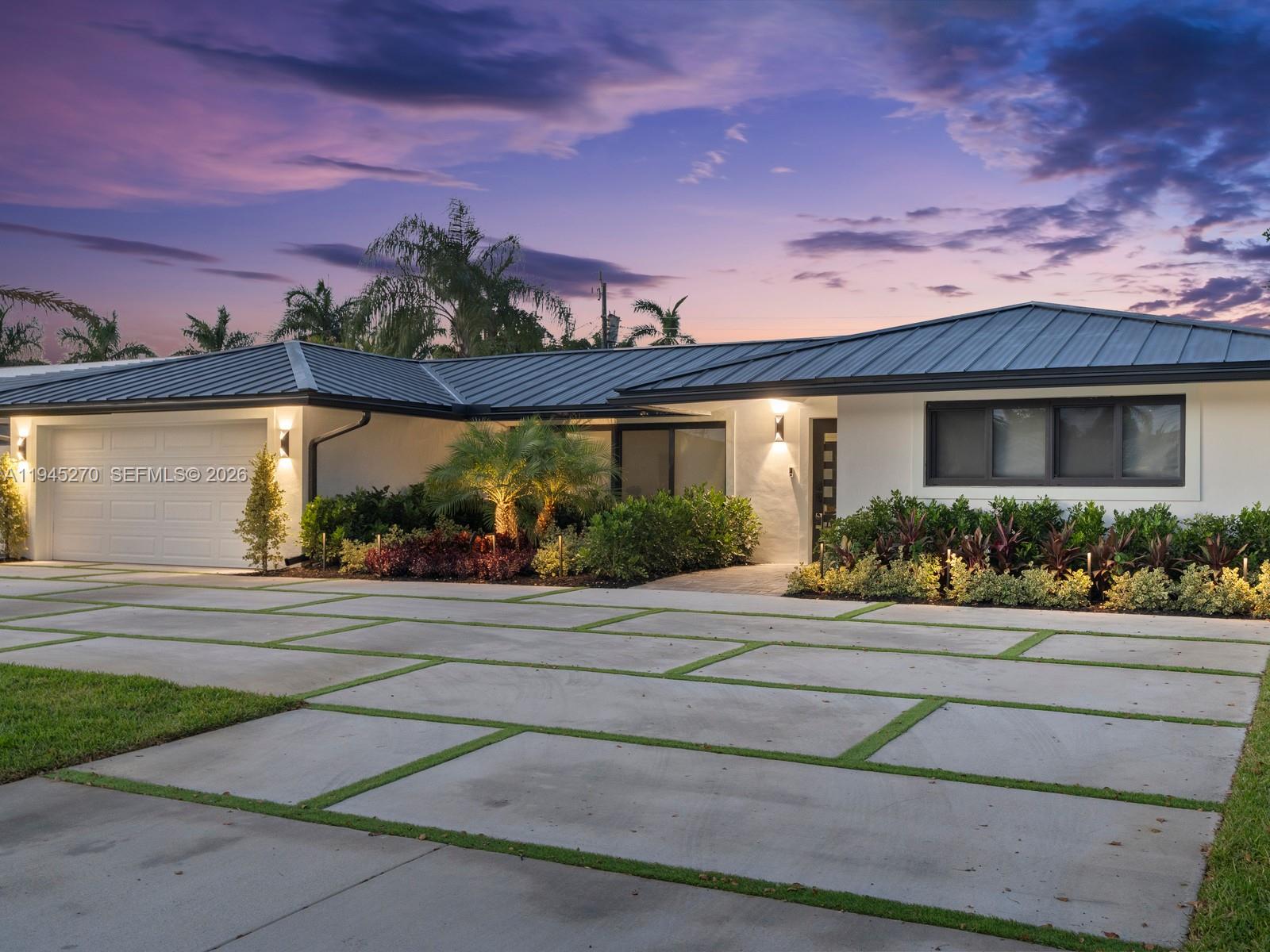 511 Southeast 14th Street Pompano Beach, FL 33060 - Photo 3 of 23 a front view of a house with a yard