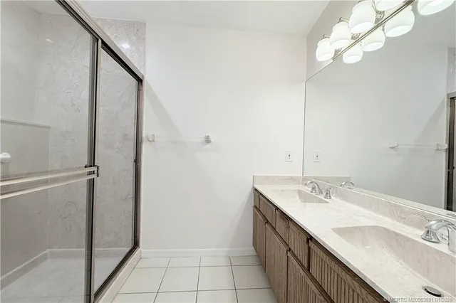 a bathroom with a sink vanity and a mirror