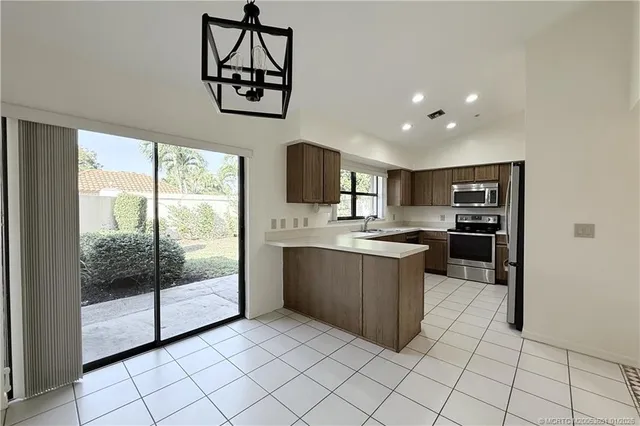 a kitchen with a refrigerator and a sink