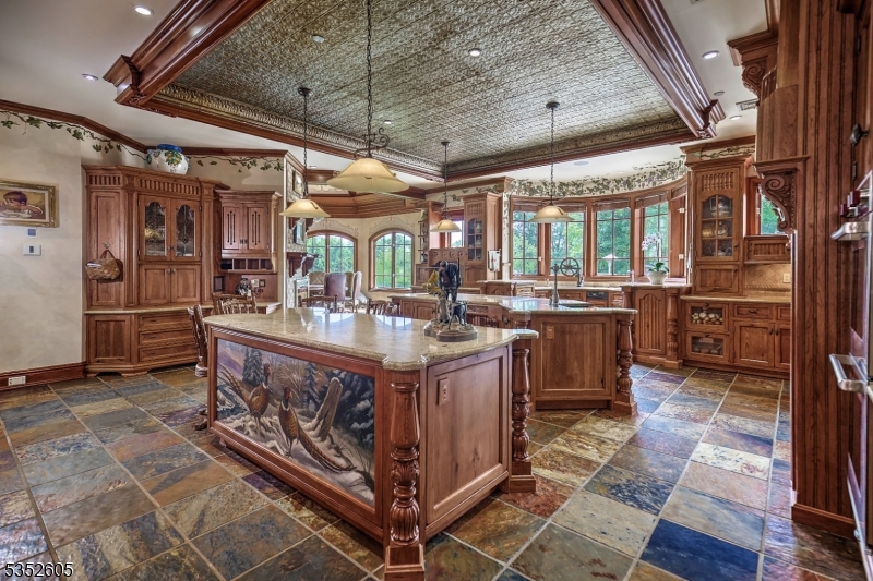 770 Pottersville Road Far Hills, NJ 07931 - Photo 12 of 29 a kitchen with stainless steel appliances granite countertop a sink a stove and a refrigerator