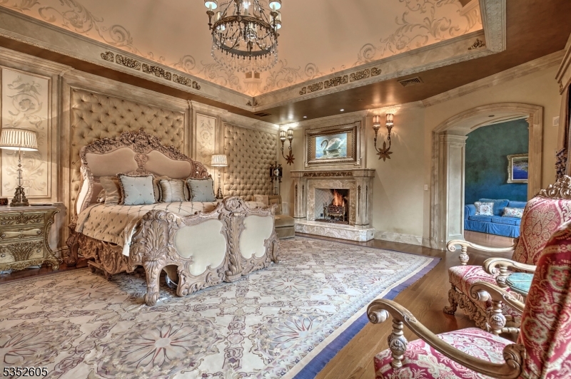 770 Pottersville Road Far Hills, NJ 07931 - Photo 16 of 29 a bed room with a bed and a fireplace
