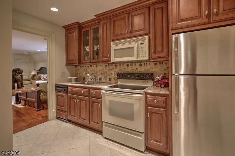 770 Pottersville Road Far Hills, NJ 07931 - Photo 22 of 29 a kitchen with stainless steel appliances granite countertop a refrigerator stove and sink