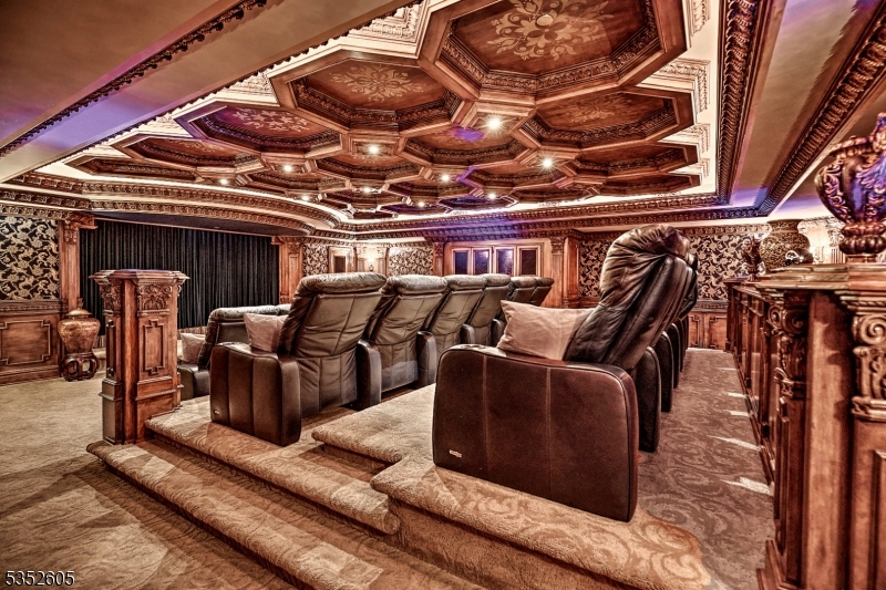 770 Pottersville Road Far Hills, NJ 07931 - Photo 25 of 29 a media room with lots of chairs and a chandelier